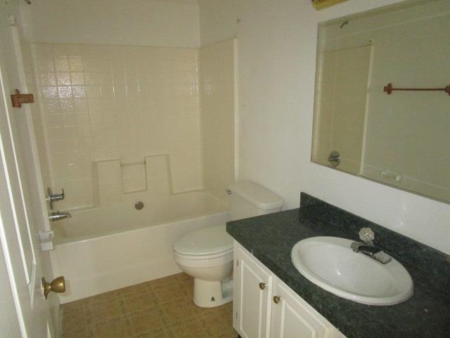 918 Fleeburg Loop Shenandoah, VA 22849 - Photo 32 of 40 a bathroom with a granite countertop sink toilet and shower