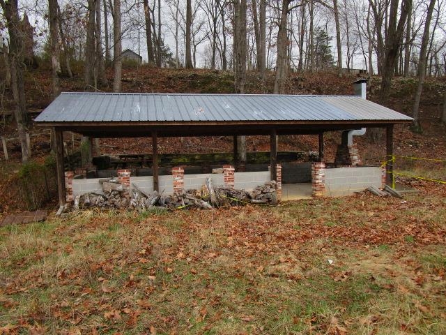 918 Fleeburg Loop Shenandoah, VA 22849 - Photo 10 of 40 a backyard of a house with barbeque oven table and chairs