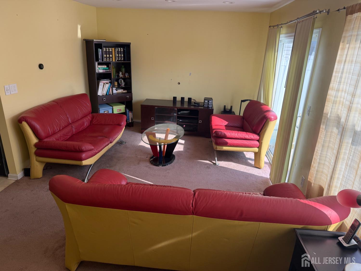 34 Mercer Street Carteret, NJ 07008 - Photo 11 of 17 a living room with furniture and a window