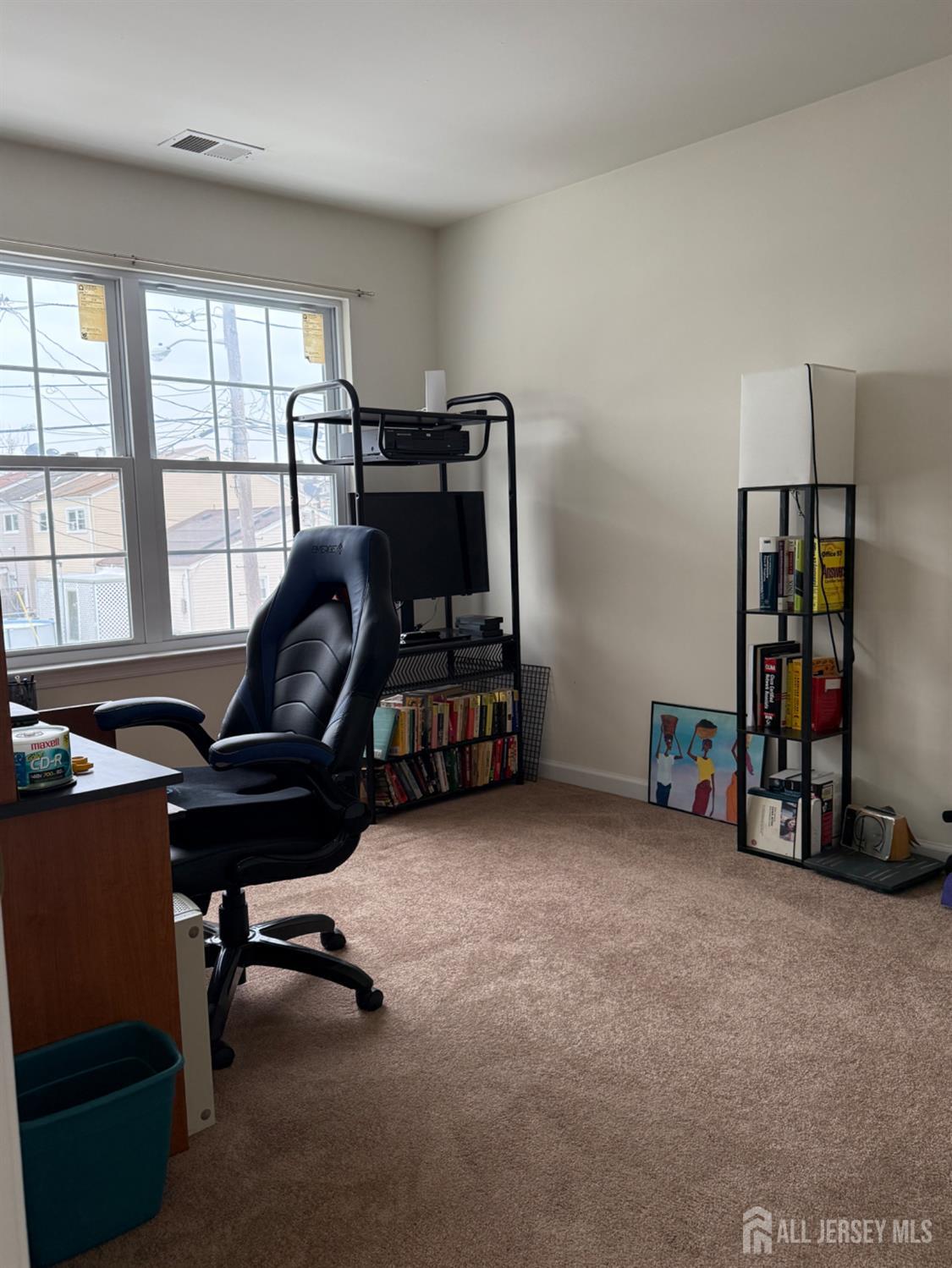 34 Mercer Street Carteret, NJ 07008 - Photo 15 of 17 a view of a workspace with furniture and a window
