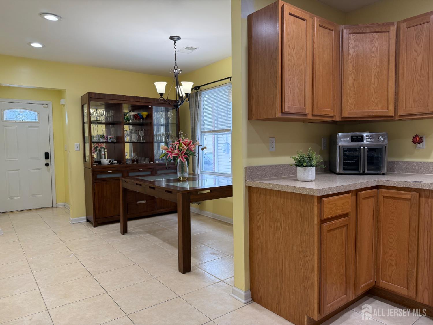 34 Mercer Street Carteret, NJ 07008 - Photo 7 of 17 a kitchen with stainless steel appliances granite countertop a sink and cabinets