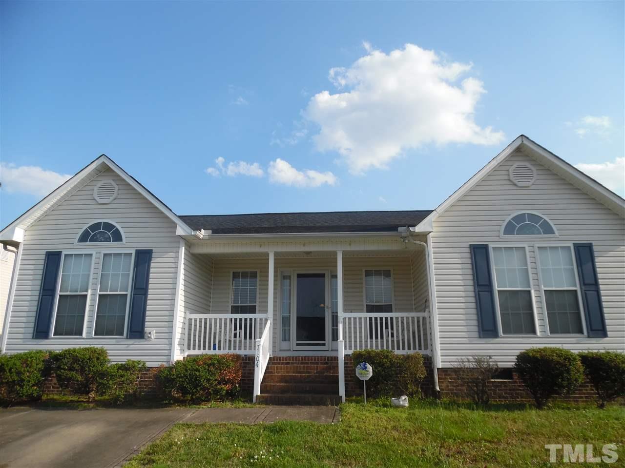 7104 Spanglers Spring Way Raleigh, NC 27610 - Photo 2 of 18 front view of a house with a yard