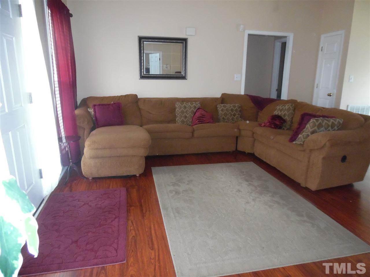 7104 Spanglers Spring Way Raleigh, NC 27610 - Photo 5 of 18 a living room with furniture and a couch