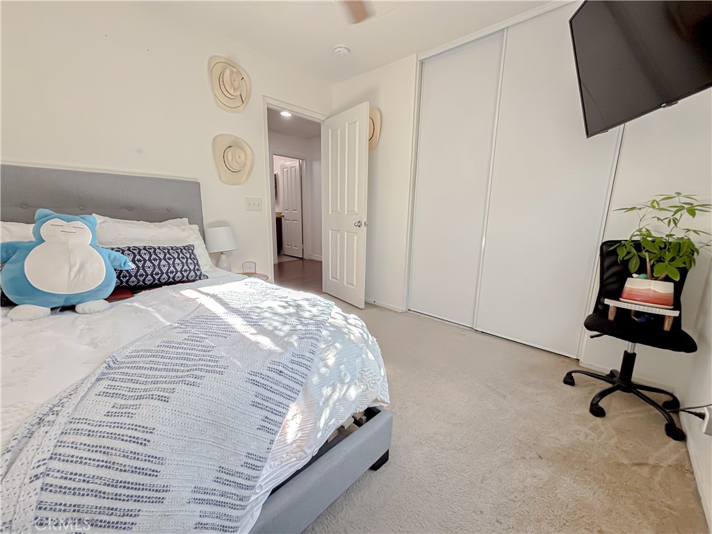 3345 James Court Lancaster, CA 93535 - Photo 21 of 29 a bedroom with a bed a desk and chair