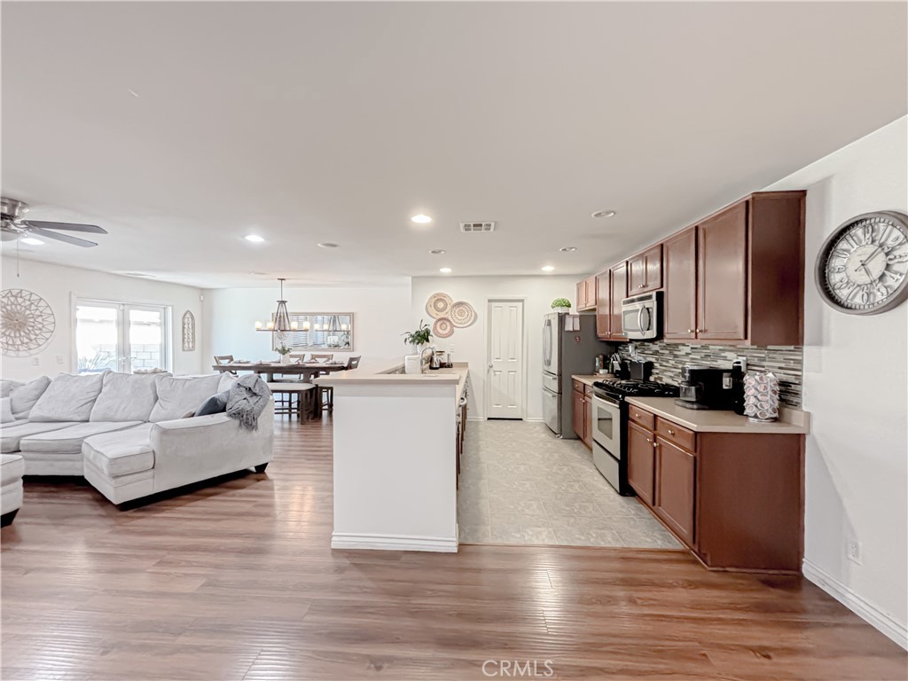 3345 James Court Lancaster, CA 93535 - Photo 6 of 29 a living room with furniture and kitchen view