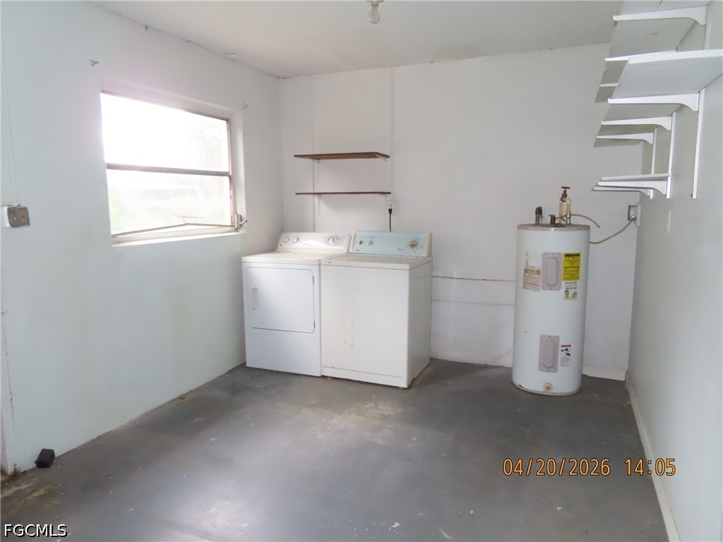 6025 Pine Lane Sebring, FL 33876 - Photo 12 of 12 a utility room with a window dryer and washer