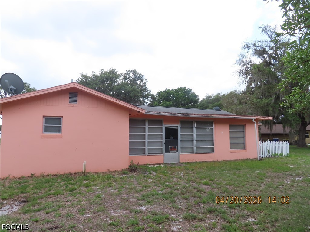 6025 Pine Lane Sebring, FL 33876 - Photo 2 of 12 a backyard of a house with lots of green space