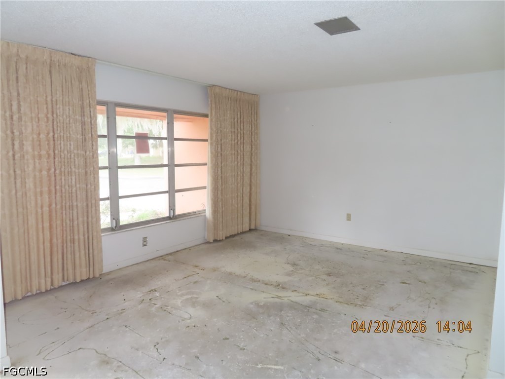 6025 Pine Lane Sebring, FL 33876 - Photo 4 of 12 an empty room with a empty space and window