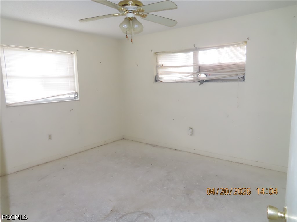 6025 Pine Lane Sebring, FL 33876 - Photo 5 of 12 an empty room with a window and a fan