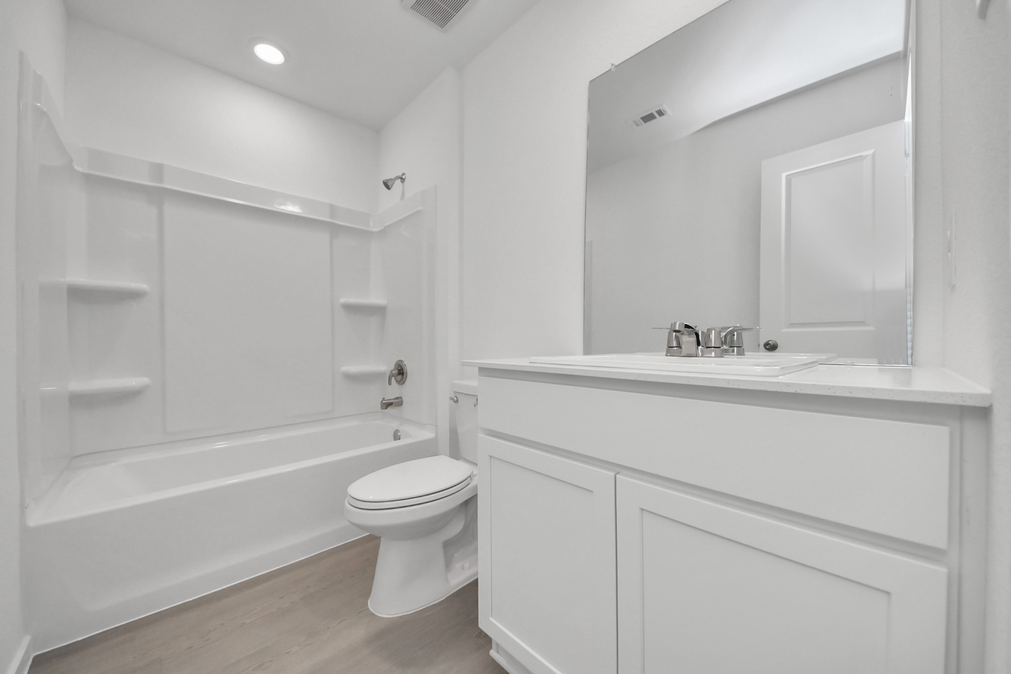 2931 Summer Breeze Way Angleton, TX 77515 - Photo 13 of 30 a bathroom with a sink a toilet and a bathtub