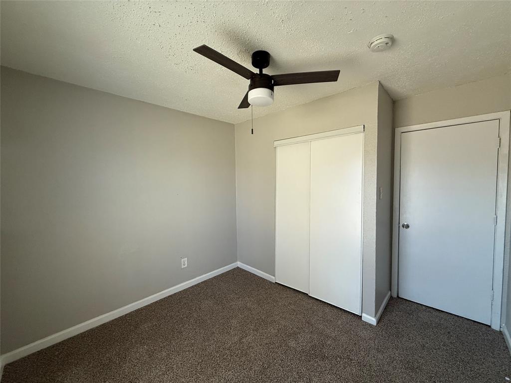 375 Ancestry Lane Dallas, TX 75217 - Photo 11 of 19 a view of a room with a ceiling fan