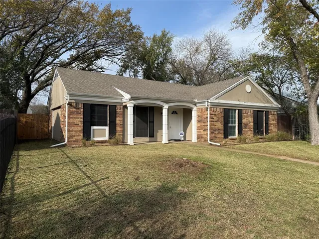 front view of a house with a garden