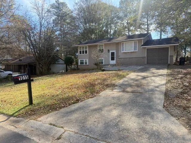 a view of a house with a yard covered in snow