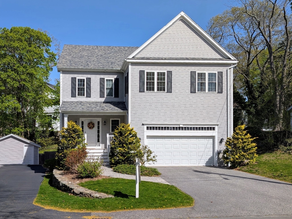 7 Hayes Road Hingham, MA 02043 - Photo 1 of 34 a front view of a house with a yard and trees