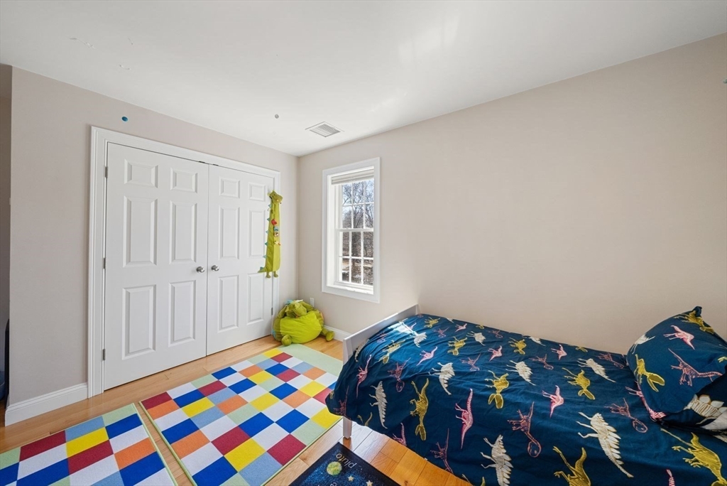 7 Hayes Road Hingham, MA 02043 - Photo 18 of 34 a bedroom with a bed and a window