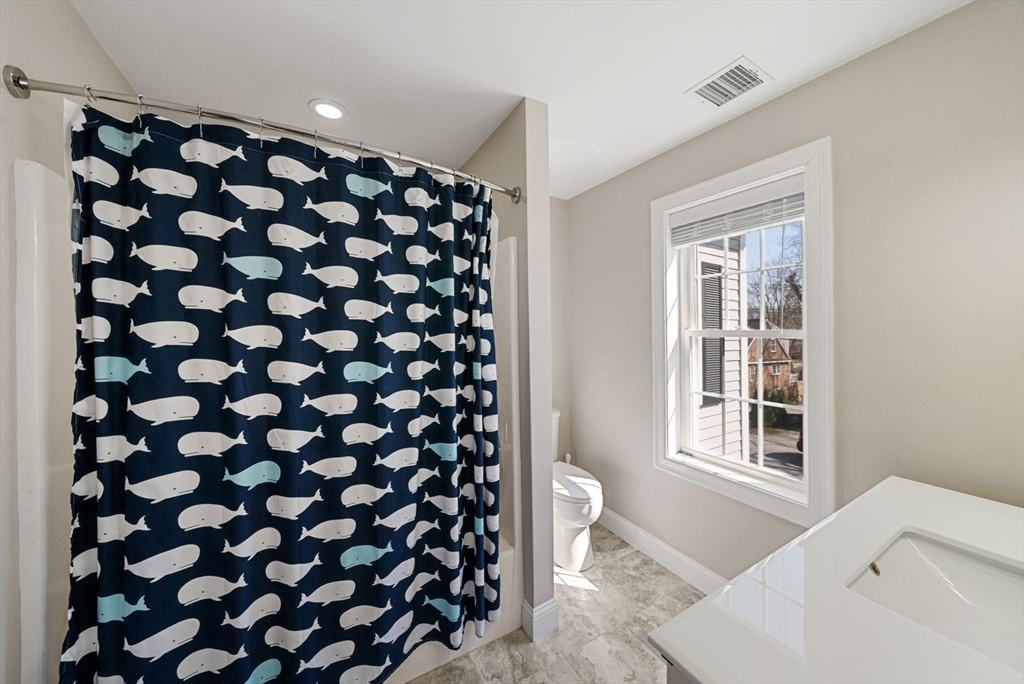 7 Hayes Road Hingham, MA 02043 - Photo 21 of 34 a bathroom with a black white checkered floor and a sink