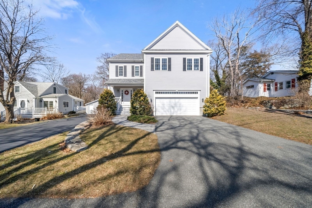 7 Hayes Road Hingham, MA 02043 - Photo 25 of 34 a view of a white house with a large tree next to a yard