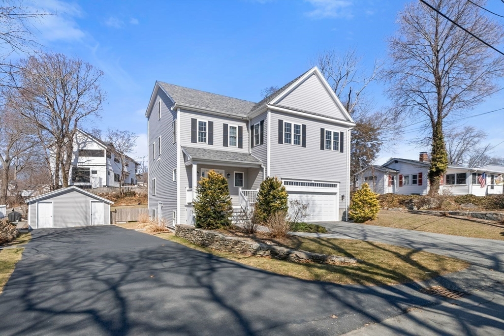 7 Hayes Road Hingham, MA 02043 - Photo 26 of 34 a view of a white house next to a road and a building