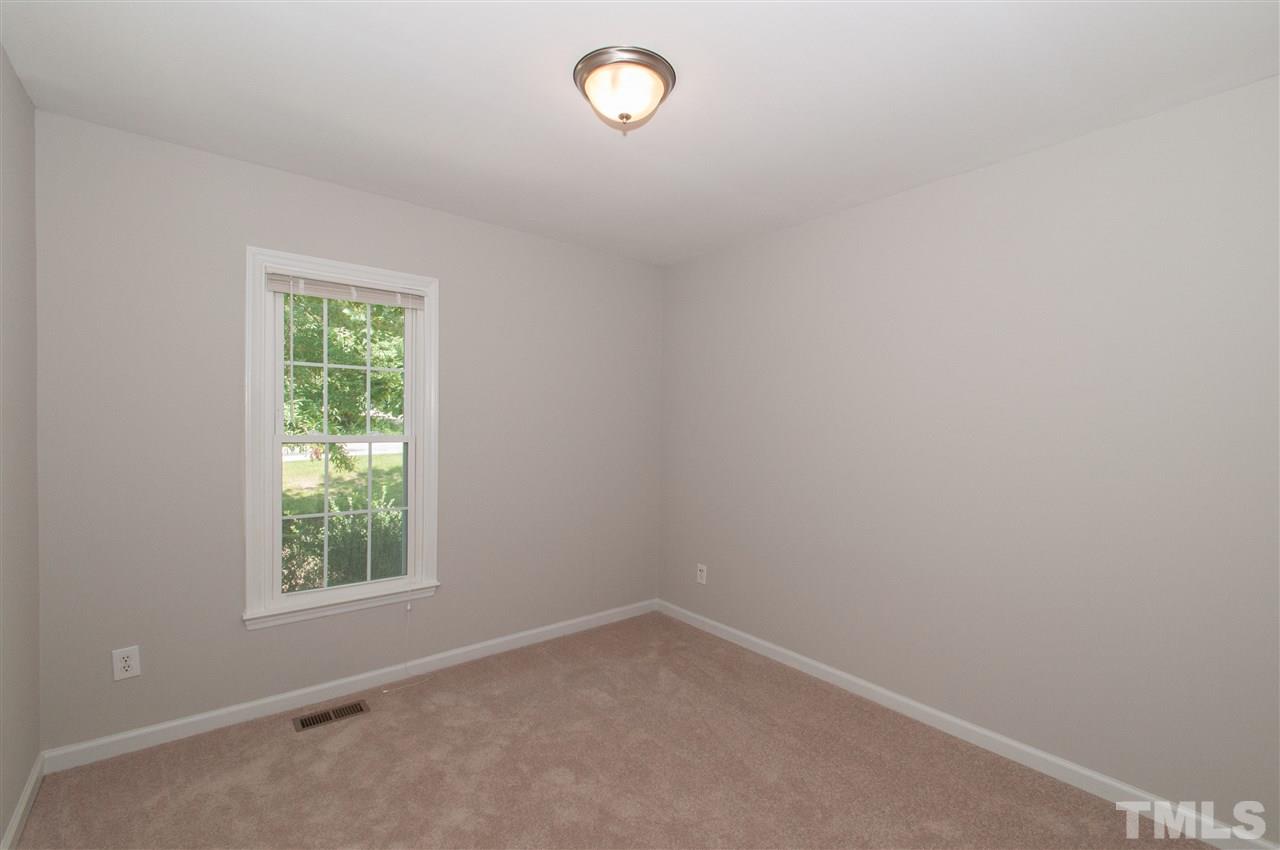 5960 Sandy Run Knightdale, NC 27545 - Photo 11 of 13 an empty room with a window
