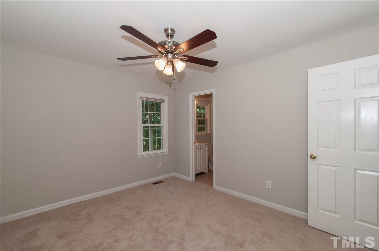 5960 Sandy Run Knightdale, NC 27545 - Photo 9 of 13 an empty room with windows and fan