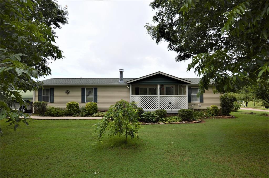 4015 Beach Road Hudson, NC 28638 - Photo 1 of 22 a front view of a house with a yard