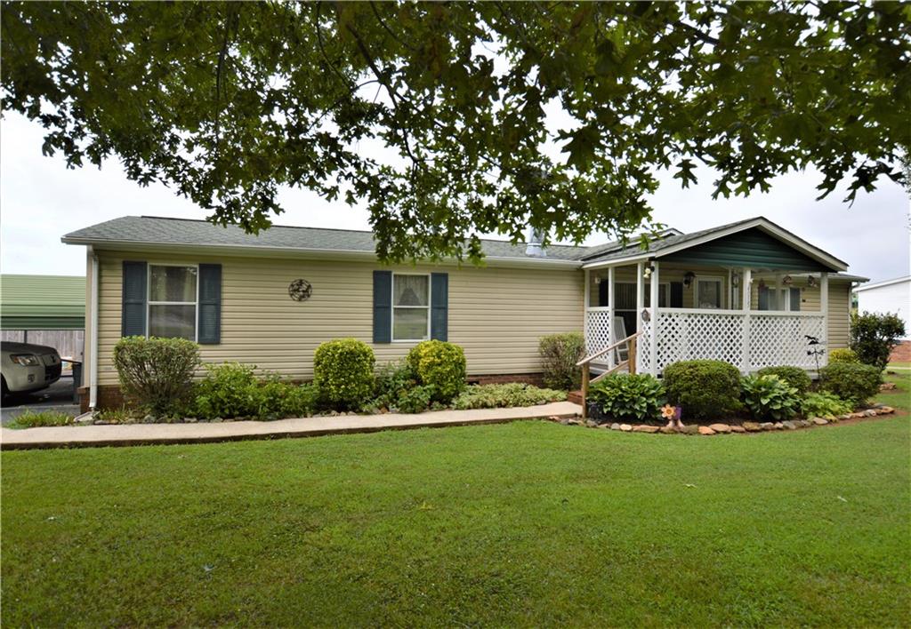 4015 Beach Road Hudson, NC 28638 - Photo 3 of 22 a front view of a house with a yard