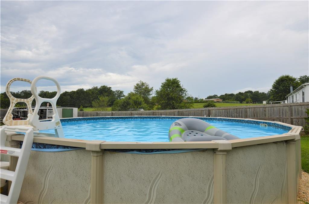 4015 Beach Road Hudson, NC 28638 - Photo 22 of 22 a view of a lake with a table and chairs