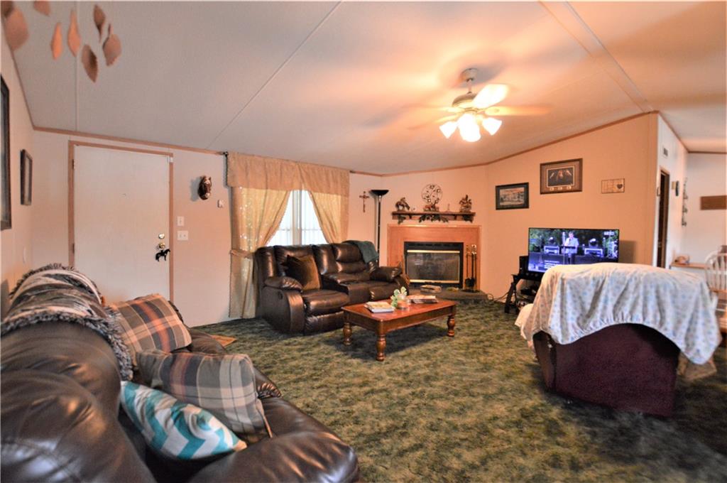 4015 Beach Road Hudson, NC 28638 - Photo 5 of 22 a living room with furniture and a chandelier