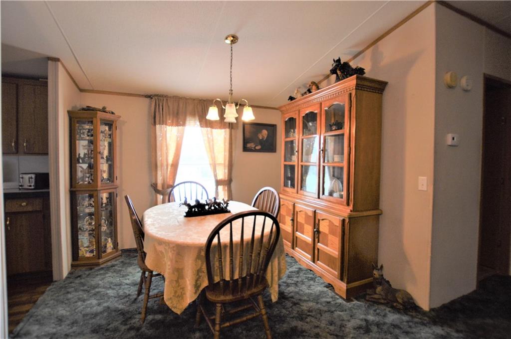 4015 Beach Road Hudson, NC 28638 - Photo 6 of 22 a view of a dining room with furniture window and wooden floor