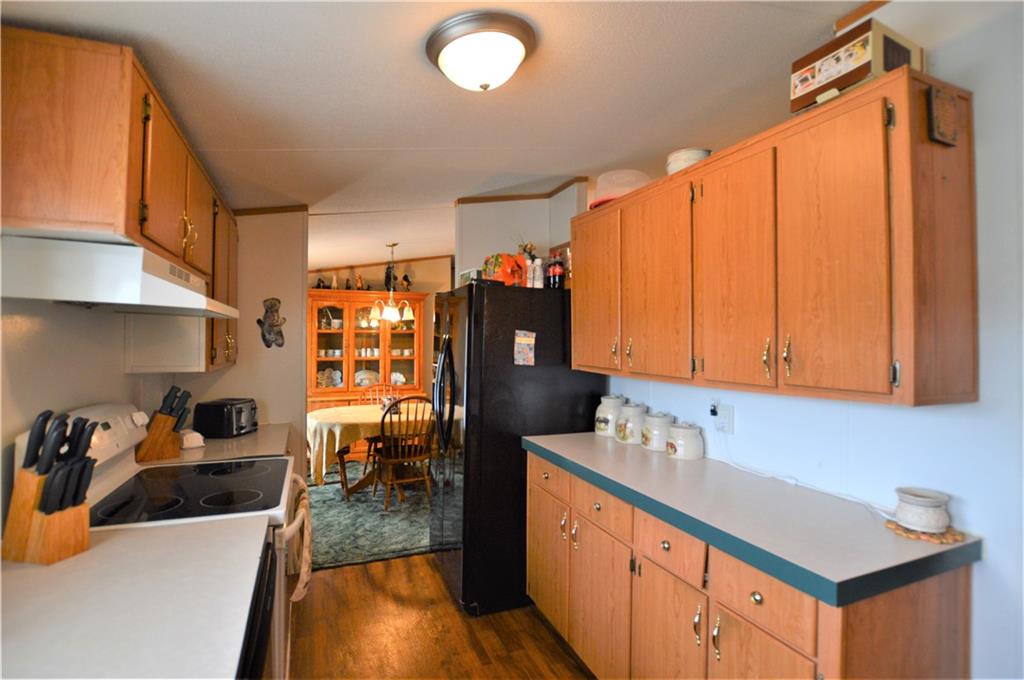 4015 Beach Road Hudson, NC 28638 - Photo 9 of 22 a kitchen with stainless steel appliances a sink stove and cabinets
