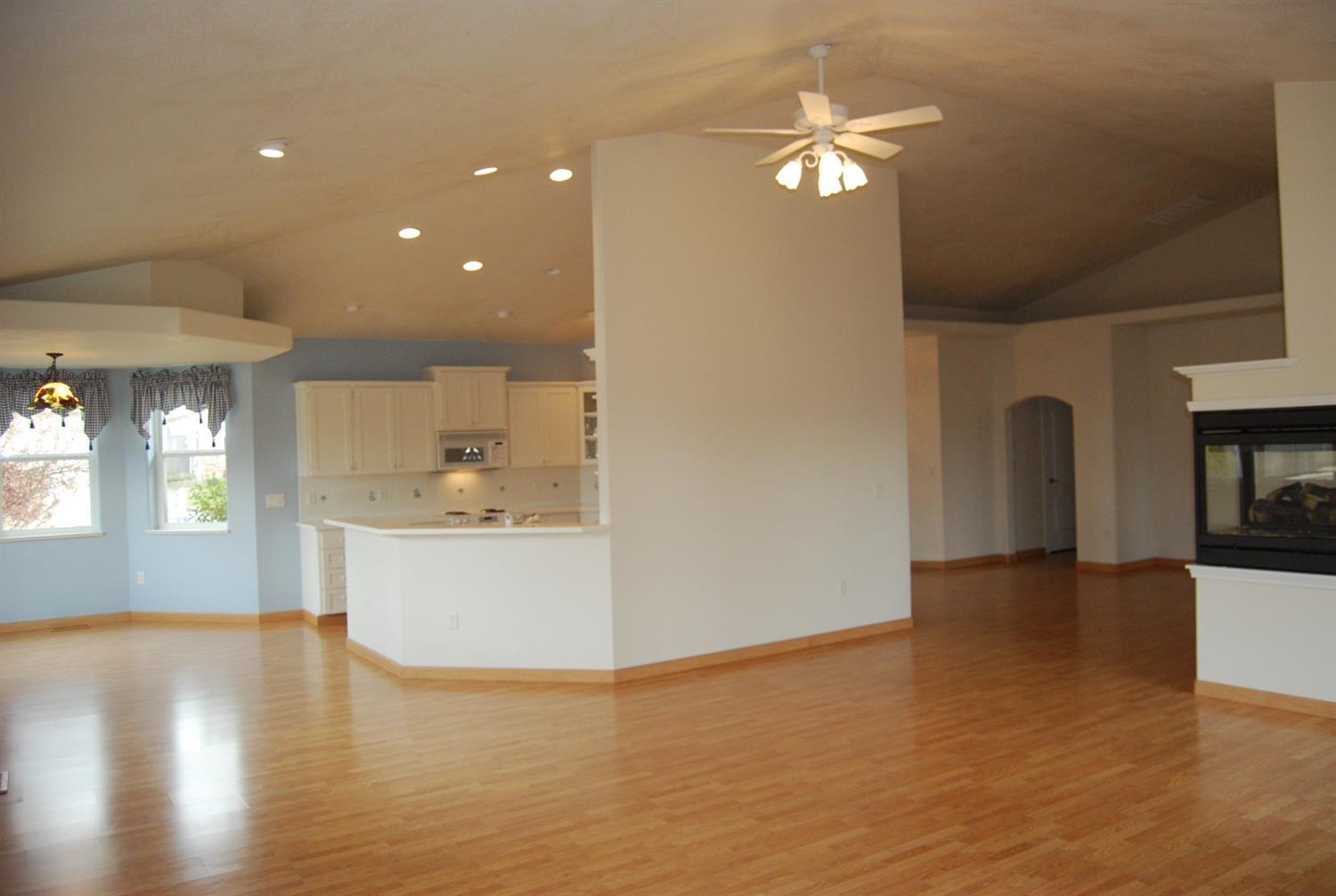 827 Ridgeway Avenue Central Point, OR 97502 - Photo 18 of 34 a view of a kitchen with a sink a fireplace and a window