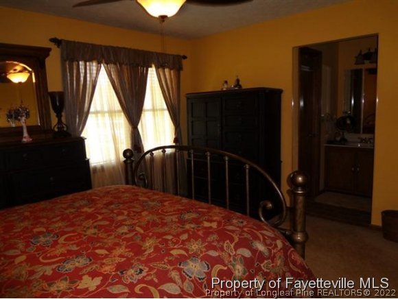 6400 Faircloth Bridge Road Stedman, NC 28391 - Photo 14 of 19 a bedroom with a bed and a window