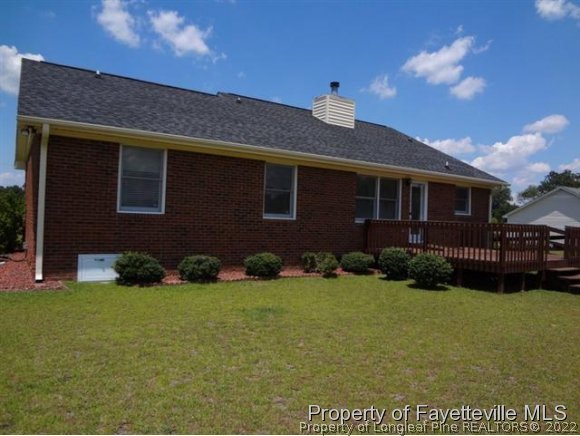 6400 Faircloth Bridge Road Stedman, NC 28391 - Photo 18 of 19 a view of a brick house with a yard