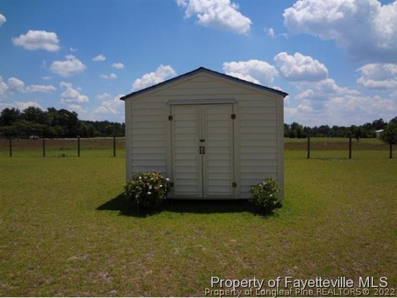 6400 Faircloth Bridge Road Stedman, NC 28391 - Photo 19 of 19 a view of a back yard of the house