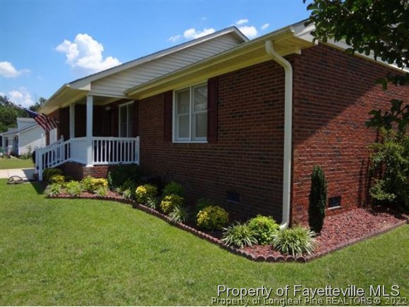 6400 Faircloth Bridge Road Stedman, NC 28391 - Photo 2 of 19 a front view of a house with a garden