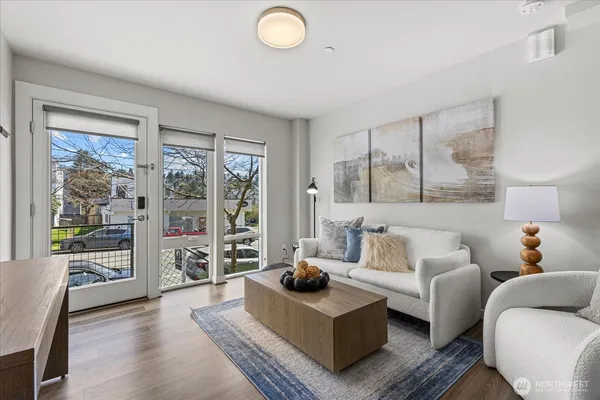 a living room with furniture and a large window
