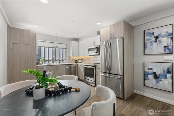 a kitchen with a refrigerator and white appliances