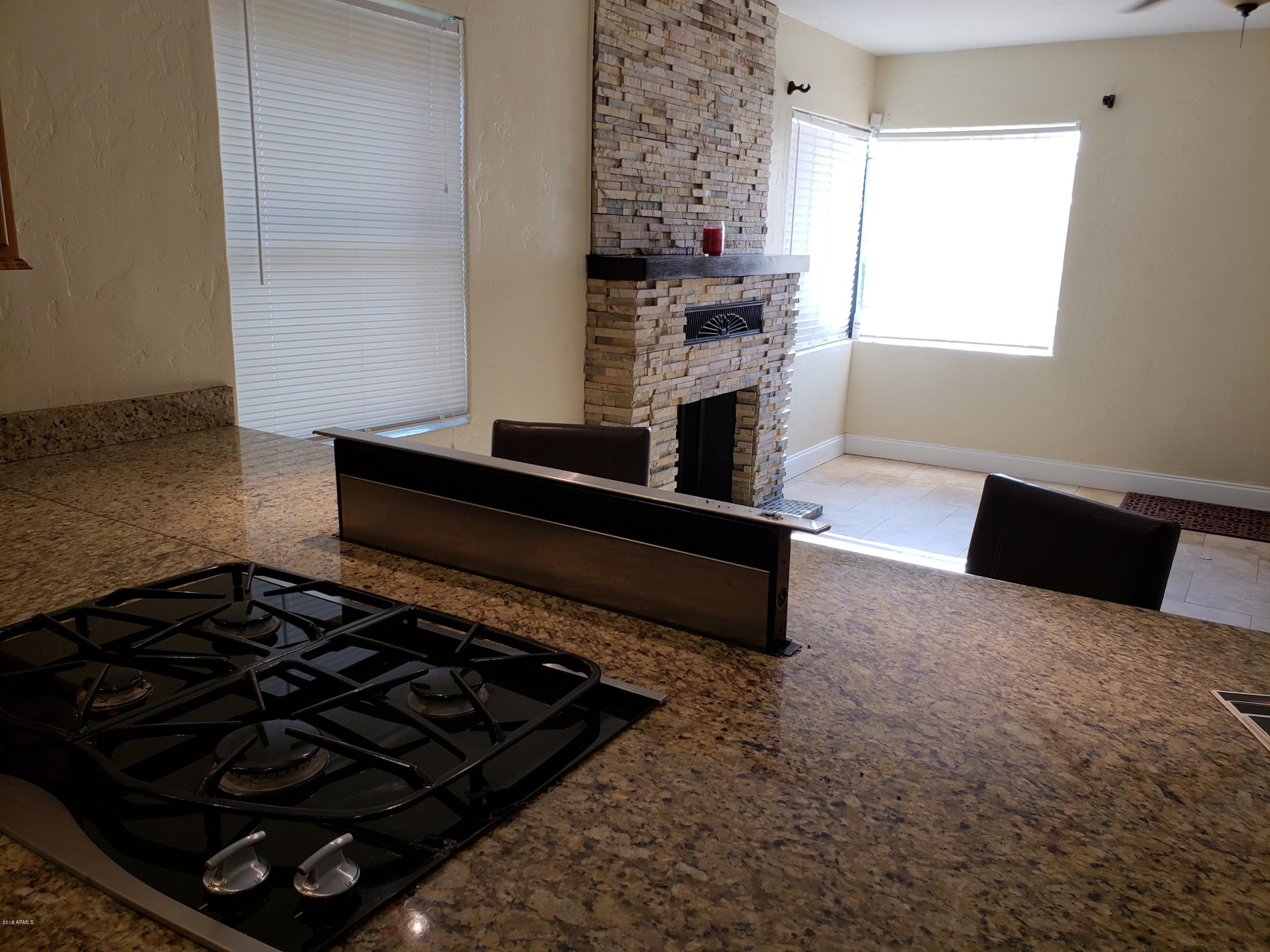 3202 North 37th Street Phoenix, AZ 85018 - Photo 3 of 20 Cooktop and retracting vent