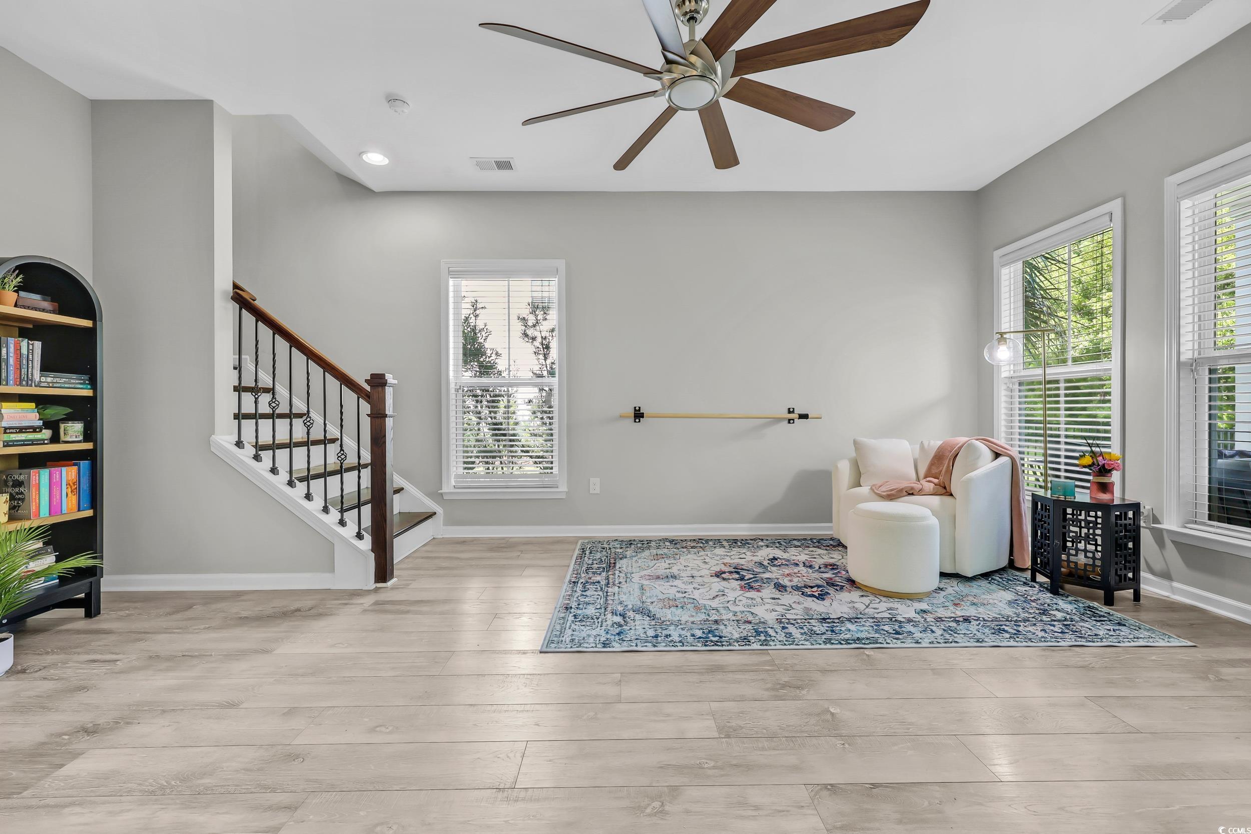 305 Splendor Circle Murrells Inlet, SC 29576 - Photo 25 of 36 Sitting room with a ceiling fan, wood finished flo