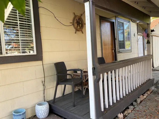 a view of a chairs and a table and chair in the balcony