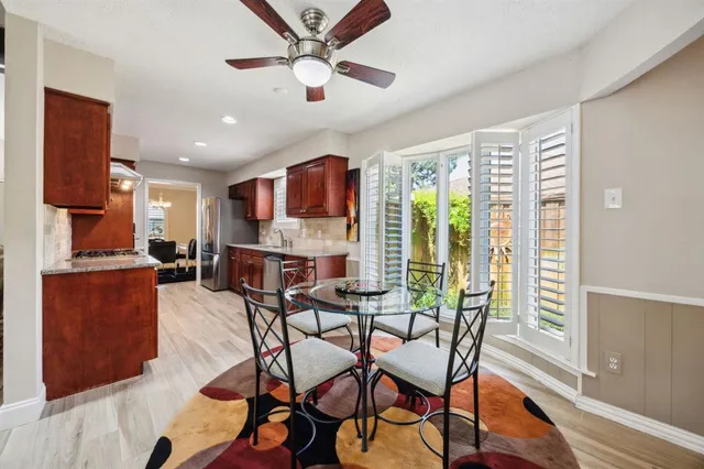 a view of a dining room with furniture window and outside view