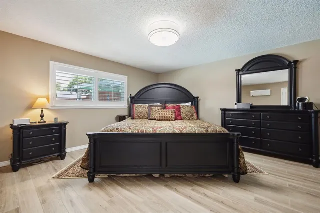 a bedroom with a bed and a dresser
