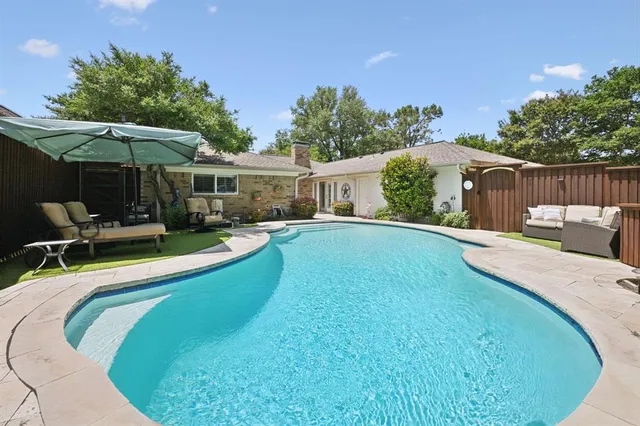 an aerial view of a house with outdoor space