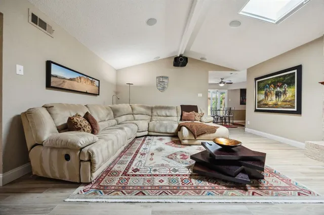 a living room with furniture and a rug
