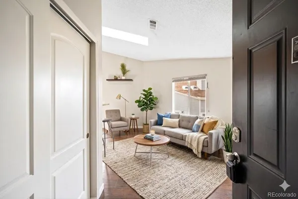 a living room with furniture and a rug