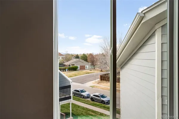 a view of a bathroom with washing machine and sink