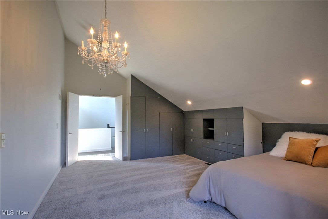 11375 Bean Road Chardon, OH 44024 - Photo 31 of 50 Bedroom featuring carpet floors, a closet, a chandelier, and high vaulted ceiling