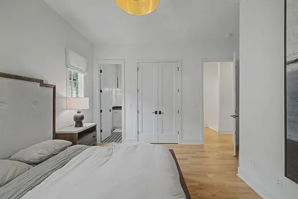 a bedroom with a bed and cabinets