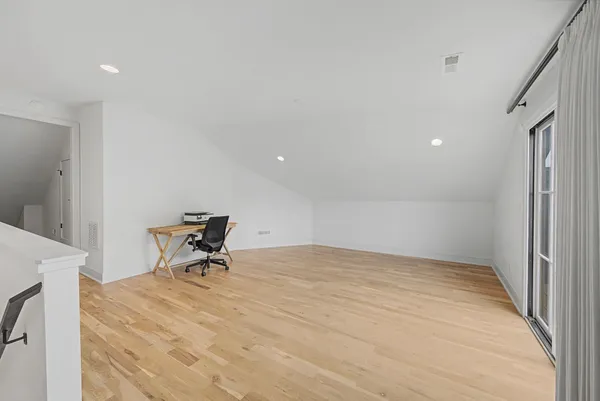 a view of room with table and chair