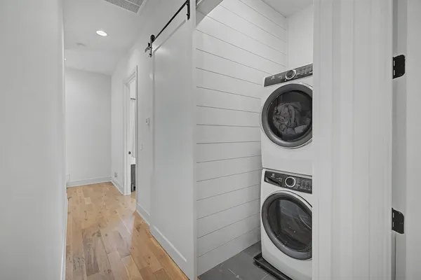 a view of a hallway with washer and dryer